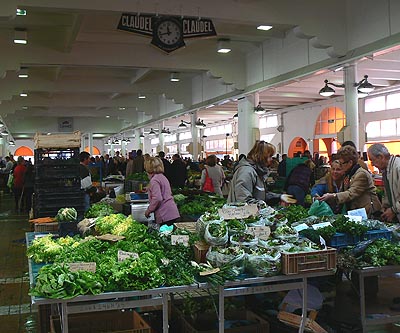 Cannes' Forville market, complete with original clock advertising Claudel cheese